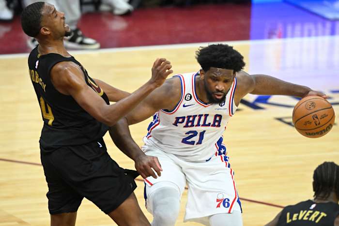 Mar 15, 2023; Cleveland, Ohio, USA; Philadelphia 76ers center Joel Embiid (21) collides with Cleveland Cavaliers forward Evan Mobley (4) in the fourth quarter at Rocket Mortgage FieldHouse. Mandatory Credit: David Richard-USA TODAY